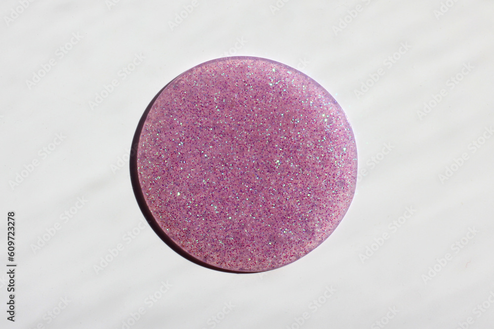 Bright and original pink background with red sequins, in the form of a circle Bright and original pink background with red sequins, in the form of a circle