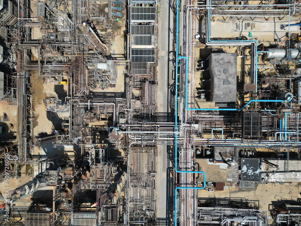 Oil refinery aerial view, shot from a drone. Production of oil and chemicals. Oil refinery aerial view, shot from a drone. Production of oil and chemicals.