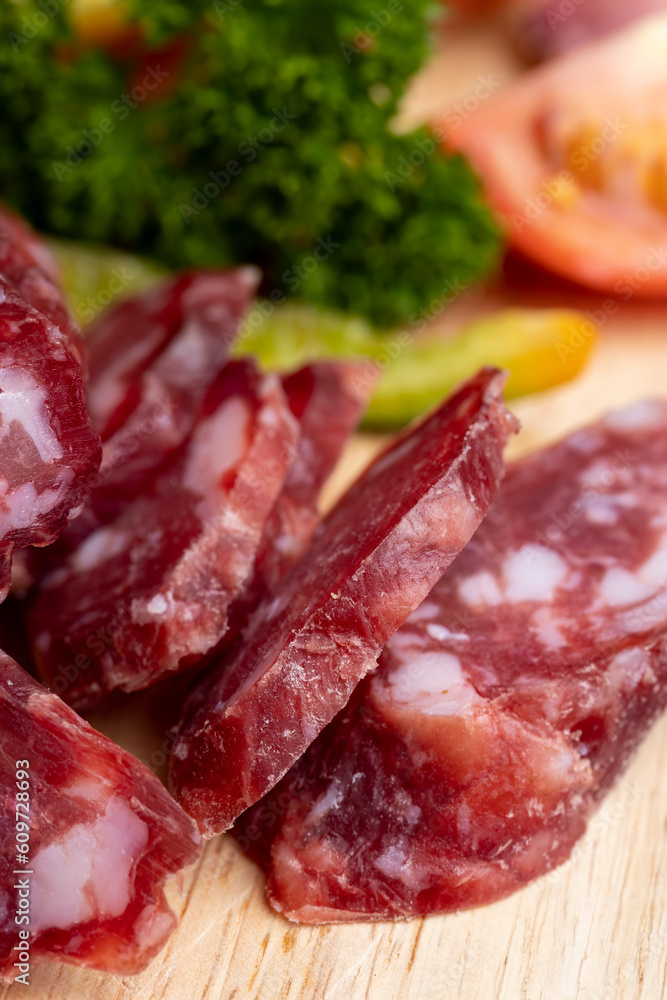 sliced sausage from pieces of meat with bacon