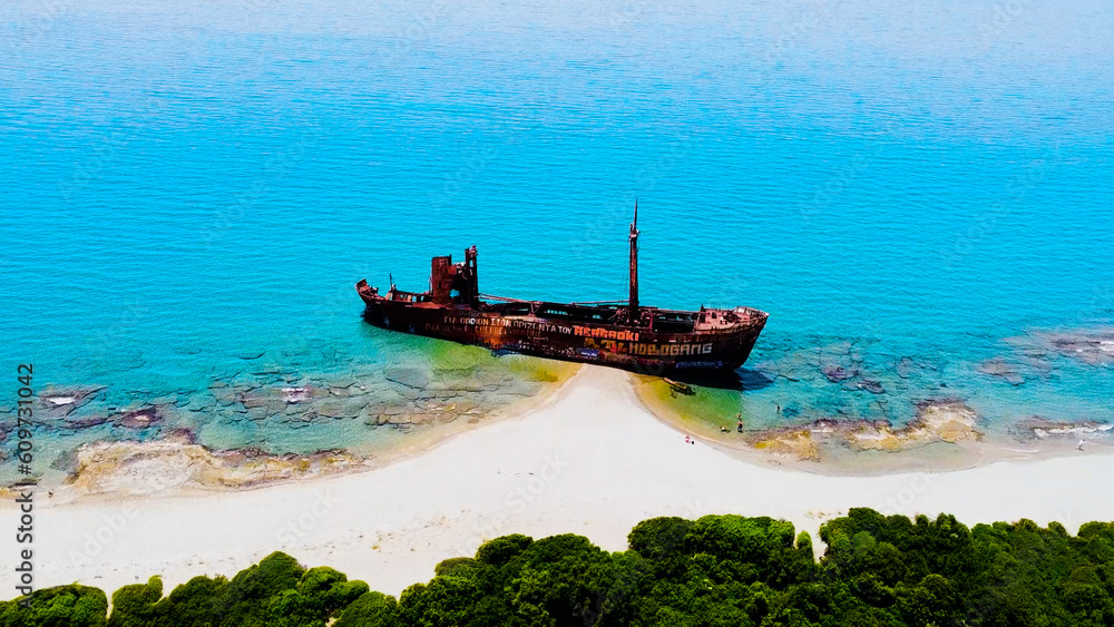 Aerial view Over a Shipwreck, Turquoise Waters, and Azure Seas in Peloponnese, Greece Aerial view Over a Shipwreck, Turquoise Waters, and Azure Seas in Peloponnese, Greece