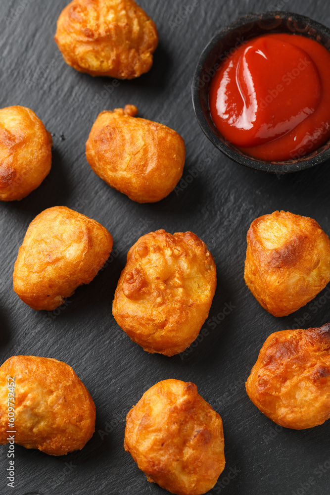Battered chicken balls with tomato ketchup, party finger food concept