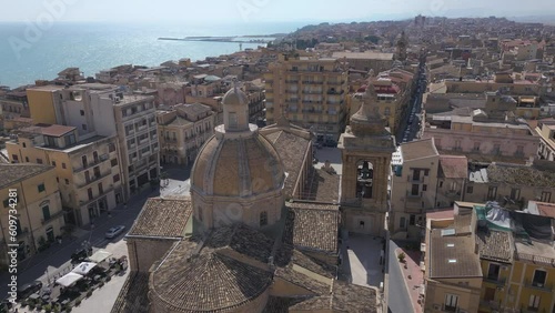 flying over church towards piazza in Gela Sicily photo