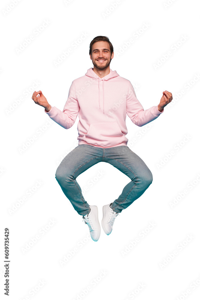 Full length body size photo of focused minded thoughtful man sitting doing yoga while jumping up in blue pants isolated on transparent background Full length body size photo of focused minded thoughtful man sitting doing yoga while jumping up in blue pants isolated on transparent background