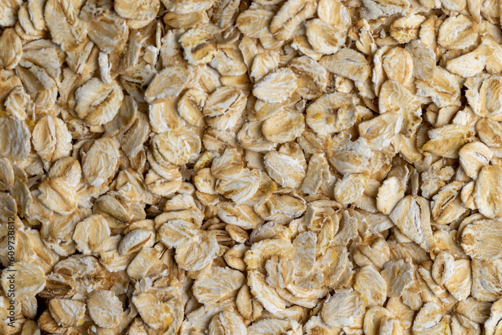 Poured a large amount of oat flakes close-up Poured a large amount of oat flakes close-up