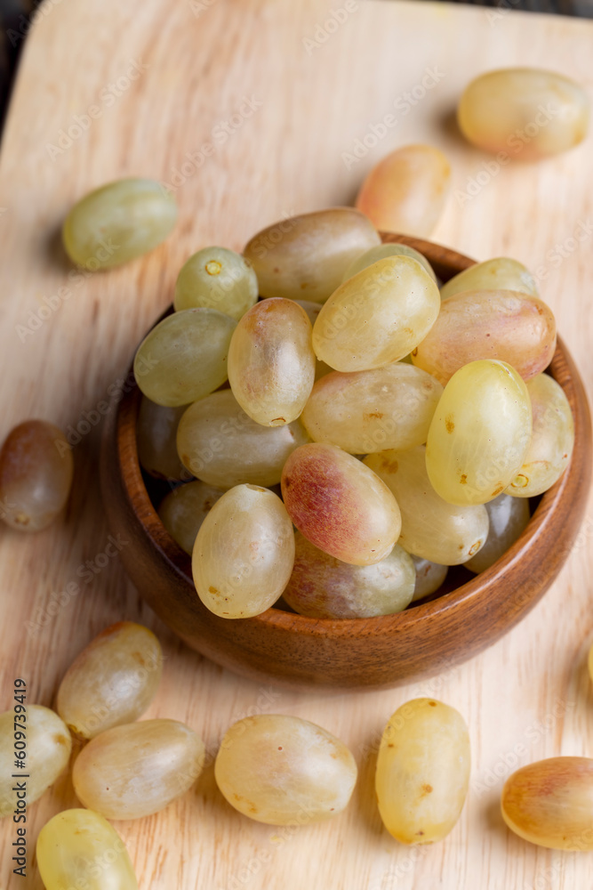 Homemade green unwashed grapes on a board