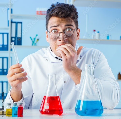 Funny mad chemist working in a laboratory