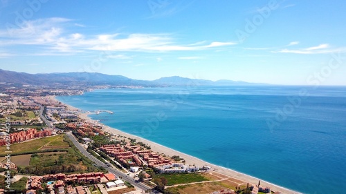 aerial view overlooking Manilva coast holiday homes and beach on the Costa del Sol as well as Duquesa Port on the Mediterranean Sea, Andalusia, Estepona, Marbella, Manilva, Malaga, Spain photo