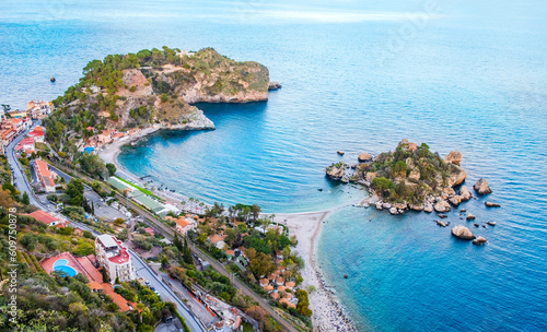 Isola Bella in Taormina, Sicily, Italy. Aerial view of small beautiful island connected with narrow path with beach. Scenic landscape of Sicilian rocky coast in Ionian sea. Popular travel destination © Julia Lavrinenko