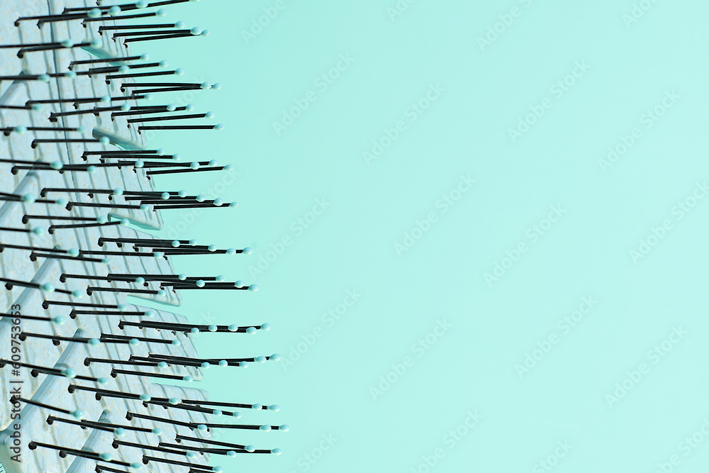 Hair brush skeleton formed shadow, blue hair accessories, copy space Hair brush skeleton formed shadow, blue hair accessories, copy space