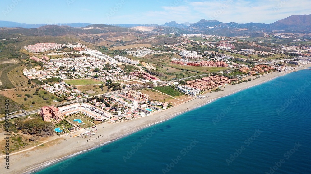 aerial view towards Manilva coast holiday homes and beach on the Costa del Sol as well as Duquesa Port on the Mediterranean Sea, Andalusia, Estepona, Marbella, Manilva, Malaga, Spain