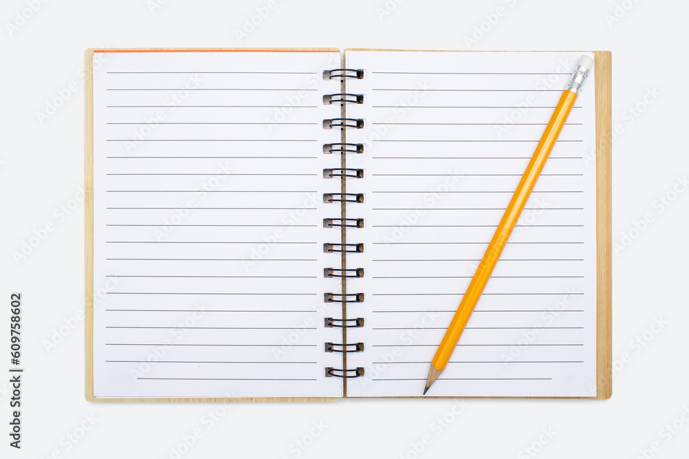 An open notebook with a binding and a yellow pencil on a white background. Open notepad with blank sheets. Free space for text. Blank notebook pages ready to be used in design An open notebook with a binding and a yellow pencil on a white background. Open notepad with blank sheets. Free space for text. Blank notebook pages ready to be used in design