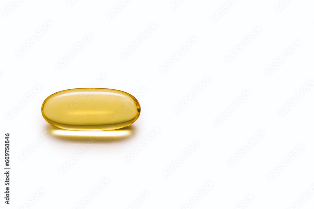 Close-up of a fish oil capsule on a white isolated background. The concept of a healthy lifestyle and taking care of your own health. Free space for text. Food supplement in a transparent capsule Close-up of a fish oil capsule on a white isolated background. The concept of a healthy lifestyle and taking care of your own health. Free space for text. Food supplement in a transparent capsule