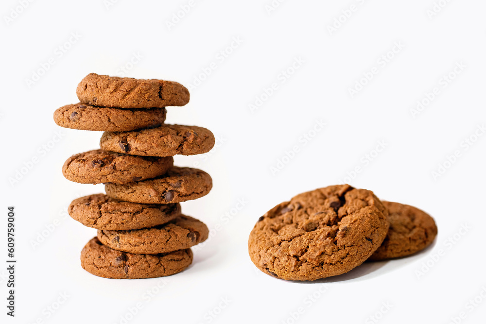 A stack of chocolate chip cookies on a white background. Delicious sweet homemade pastries beautifully stacked close up. Chocolate flavored homemade biscuits A stack of chocolate chip cookies on a white background. Delicious sweet homemade pastries beautifully stacked close up. Chocolate flavored homemade biscuits