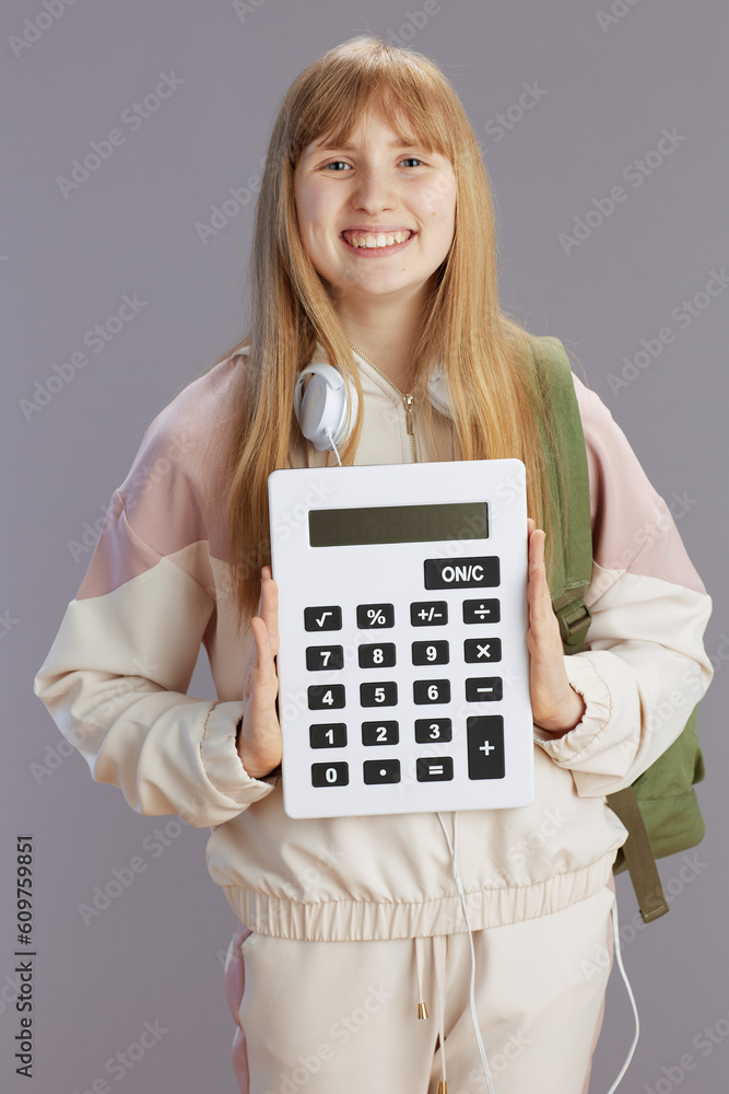 Portrait of smiling trendy girl in beige tracksuit Portrait of smiling trendy girl in beige tracksuit