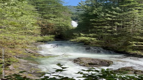 4K video of the lower Wallace water falls flowing into river in Washington state park during spring season photo