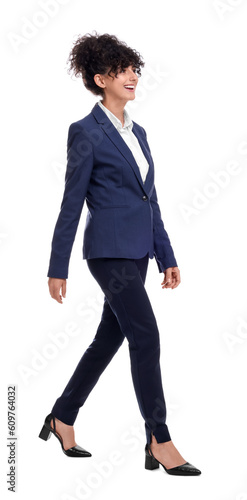 Beautiful businesswoman in suit walking on white background
