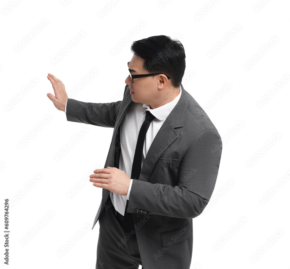 Scared businessman in suit posing on white background Scared businessman in suit posing on white background