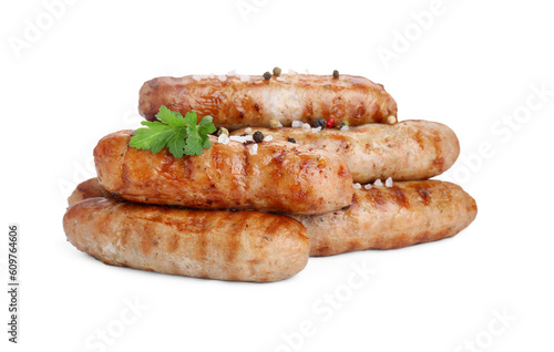 Tasty grilled sausages with spices and parsley isolated on white