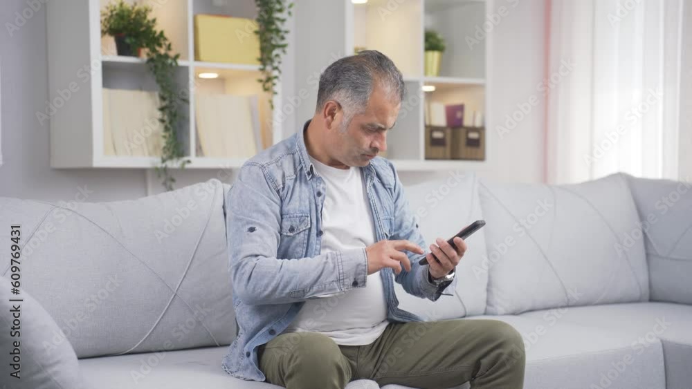 The man who gets angry and upset at the incoming phone message. The man who gets angry and upset at the incoming phone message.