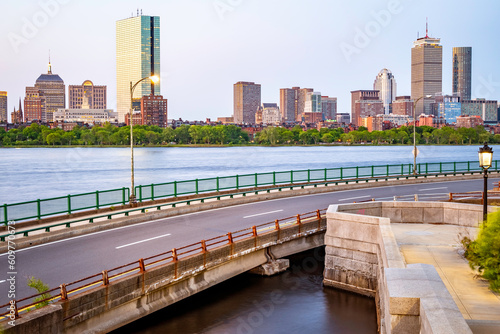 The city of Boston in the summer sun at sunrise at Backbay neighborhood with the Charles River and its mix of contemporary and historic buildings.