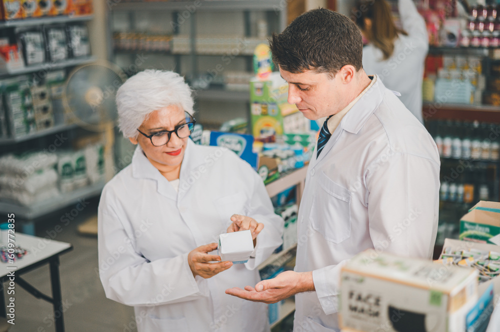 skilled pharmacist is consulting, analyzing the use of drugs to recommend and supervise patients according to prescriptions in modern pharmacies.
