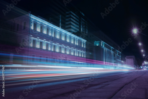 Road traffic  motion blur effect. View of night cityscape with car light trails