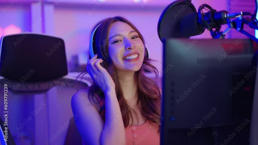 Asian young audio DJ woman sing a song on microphone to broadcasting. Asian young audio DJ woman sing a song on microphone to broadcasting.