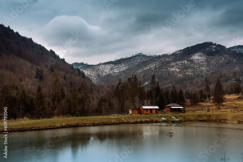 A lake in the Carpathian Mountains in autumn in November in fog