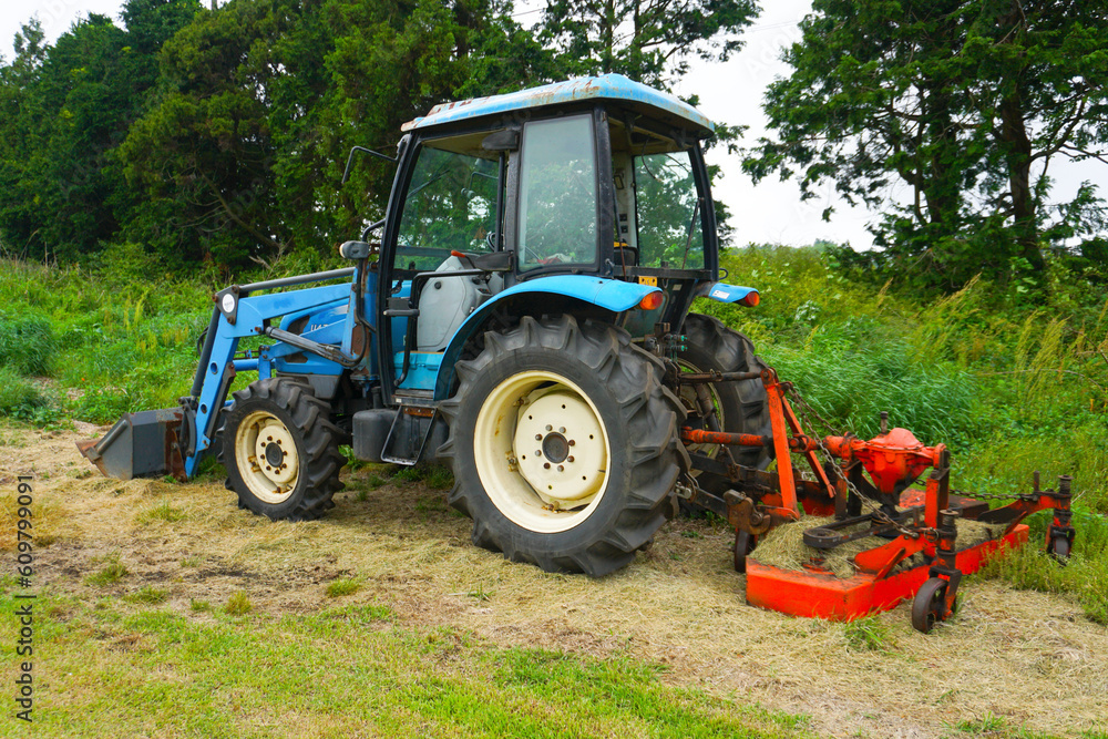Tractor machine stopped in a green field Tractor machine stopped in a green field