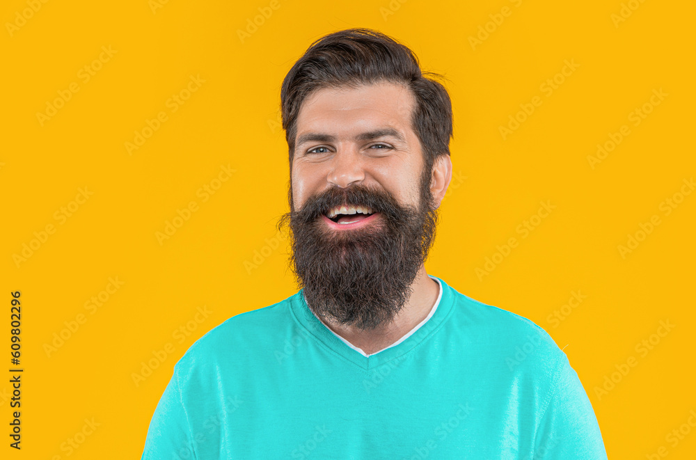 portrait of happy bearded man isolated on yellow. portrait of bearded man in studio. portrait of happy bearded man isolated on yellow. portrait of bearded man in studio.
