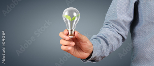 Humans hold light bulbs in hand innovative technology
