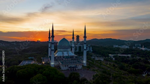 4K hyperlapse of Masjid Sultan Salahuddin Abdul Aziz Shah - The Blue Mosque during sunset. Biggest Mosque in Southeast Asia, Shah Alam, Malaysia. 