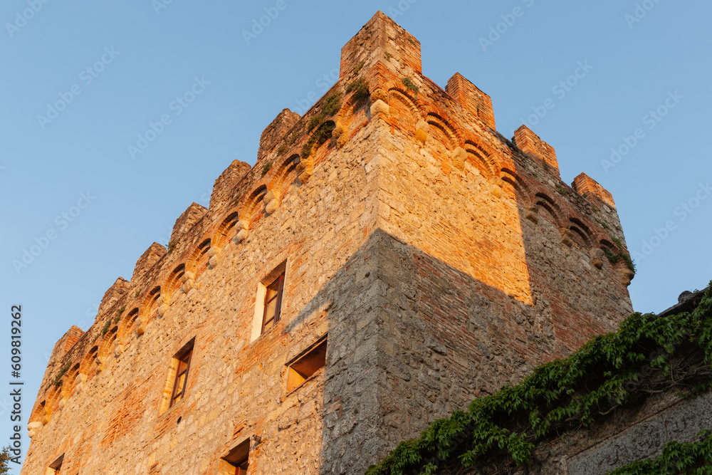 Stone building with battlements from low angle of view