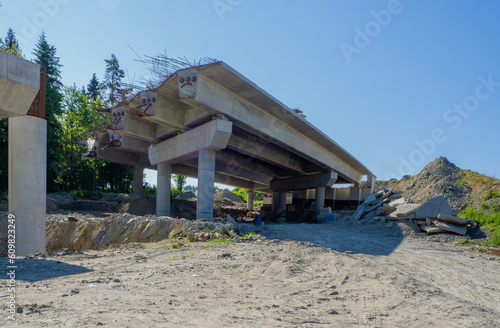 New fragment of highway on pillars under construction on Zakopianka road in Poland from Krakow to Zakopane and Nowy Targ over a small valley near Rdzawka village. State in June 2023 photo