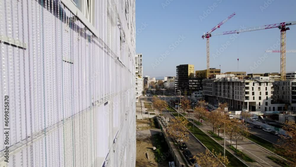 aerial drone, building and street, construction site with cranes, new neighbourhood emerging, gentrification, French city, Montpellier suburbs, sunny summer weather, bright blue sky, architecture. aerial drone, building and street, construction site with cranes, new neighbourhood emerging, gentrification, French city, Montpellier suburbs, sunny summer weather, bright blue sky, architecture.