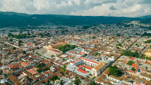 Beautiful aerial view of the rooftops of the old colonial buildings in the city of san cristobal de las Casas on the sunset © IBRESTER