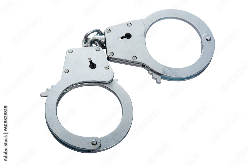 Metal handcuffs on a white isolated background, copy space Metal handcuffs on a white isolated background, copy space