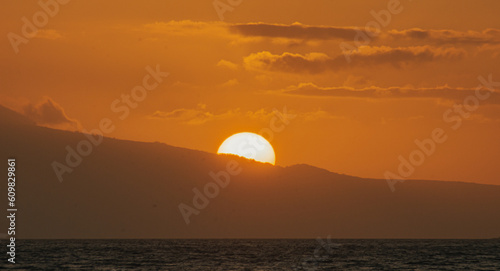 Fototapeta Naklejka Na Ścianę i Meble -  Magical golden sunset from Maui beach, sea and mountain background. 