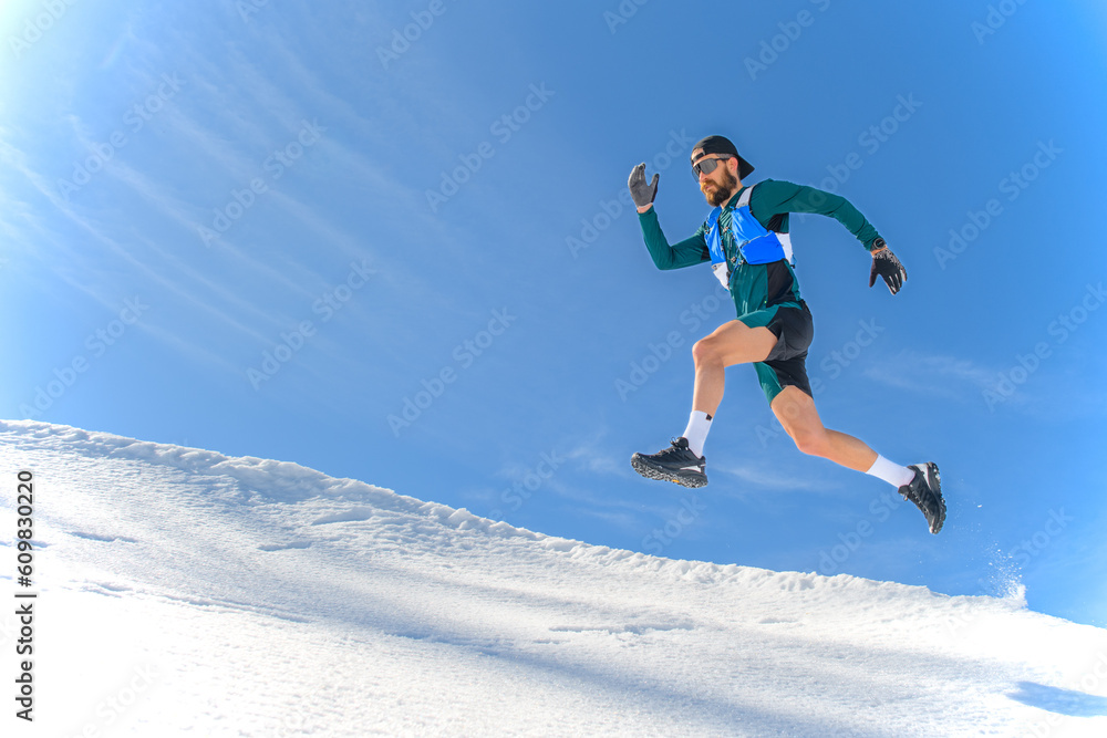 A sportsman jumps in the snow