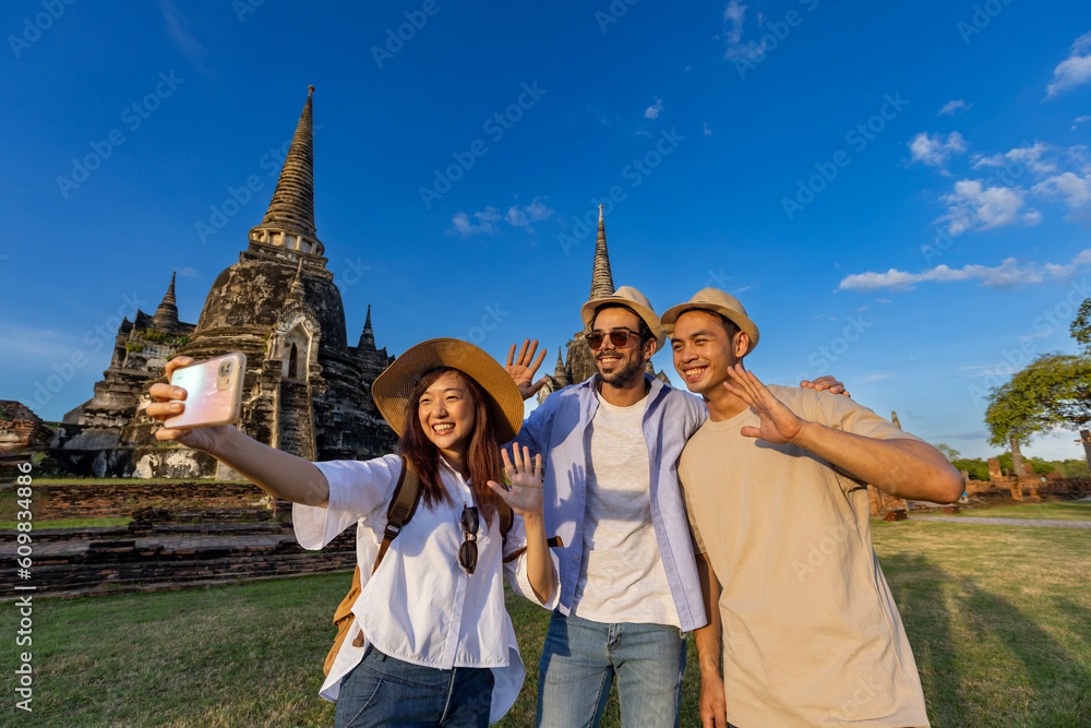 Tourists take selfie photo at Wat Phra Si Sanphet temple, Ayutthaya Thailand, for travel, vacation, holiday, honeymoon and tourism concept