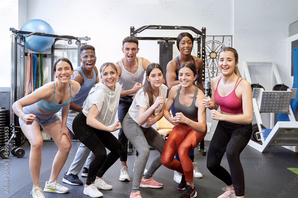 Fototapeta premium Diverse Group of Friends in Gym, Looking at Camera, Enjoying Themselves