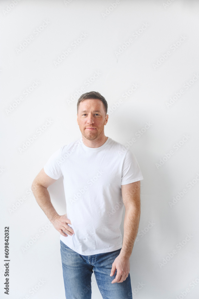 Man with hand on hip against white background Man with hand on hip against white background