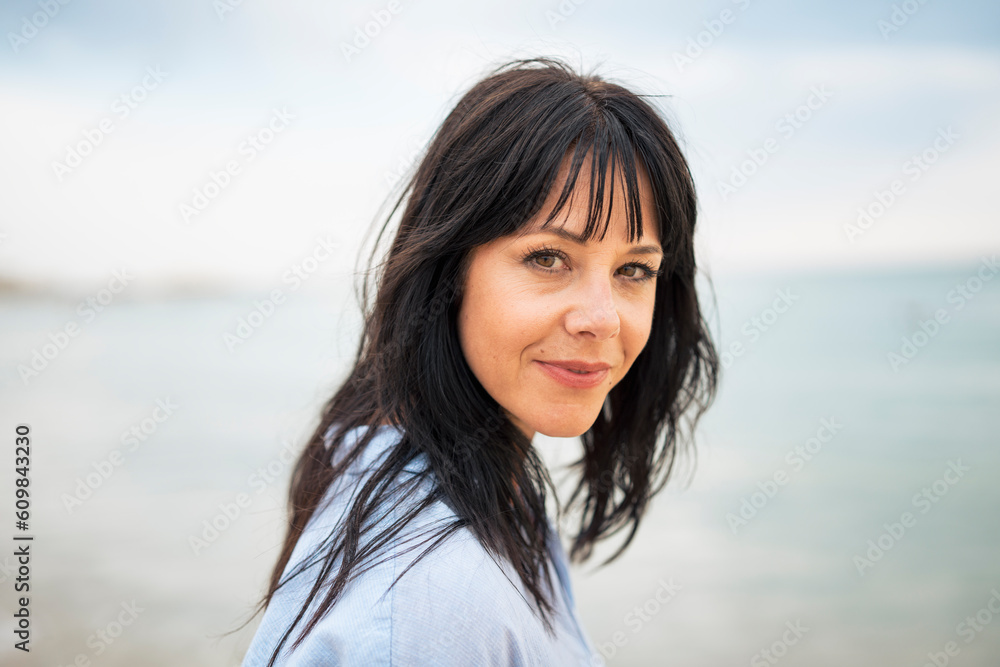 Mature woman with bangs at beach Mature woman with bangs at beach