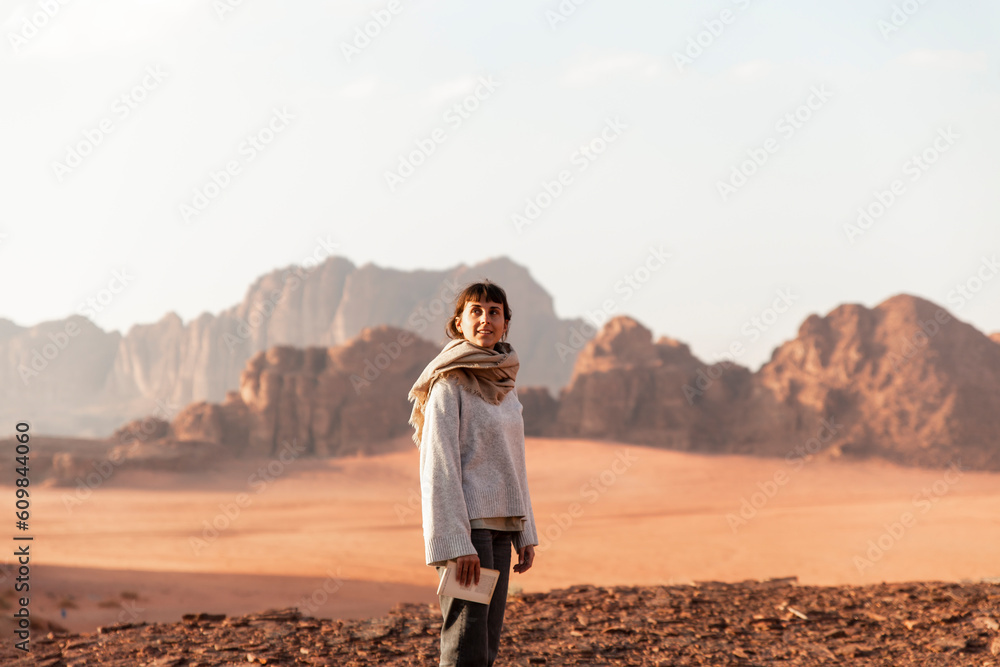 Happy young woman standing in desert Happy young woman standing in desert
