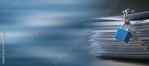 Documents locked with padlock and chains.