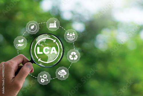 LCA, Life cycle assessment concept.LCA icon inside magnifier glass.  ISO LCA standard aims to limit climate change. Methodology for assessing environmental impacts associated on value chain product.