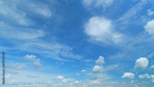 Fluffy layered clouds sky atmosphere. Puffy fluffy white clouds. Formation cloud sky scape. Timelapse.