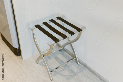 Luggage Rack suitcase stand chair for placing heavy bag convenience manage in Hotel room. photo