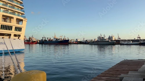 The back of a luxury cruise ship in the harbor