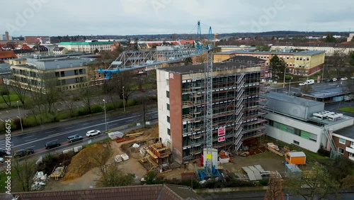 Aerial drone rotating shot over an empty under construction building site in Brunswick, Germany during evening time. photo